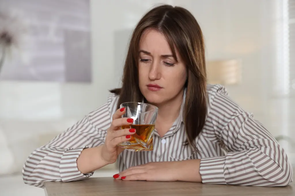 Woman Contemplating Drink
