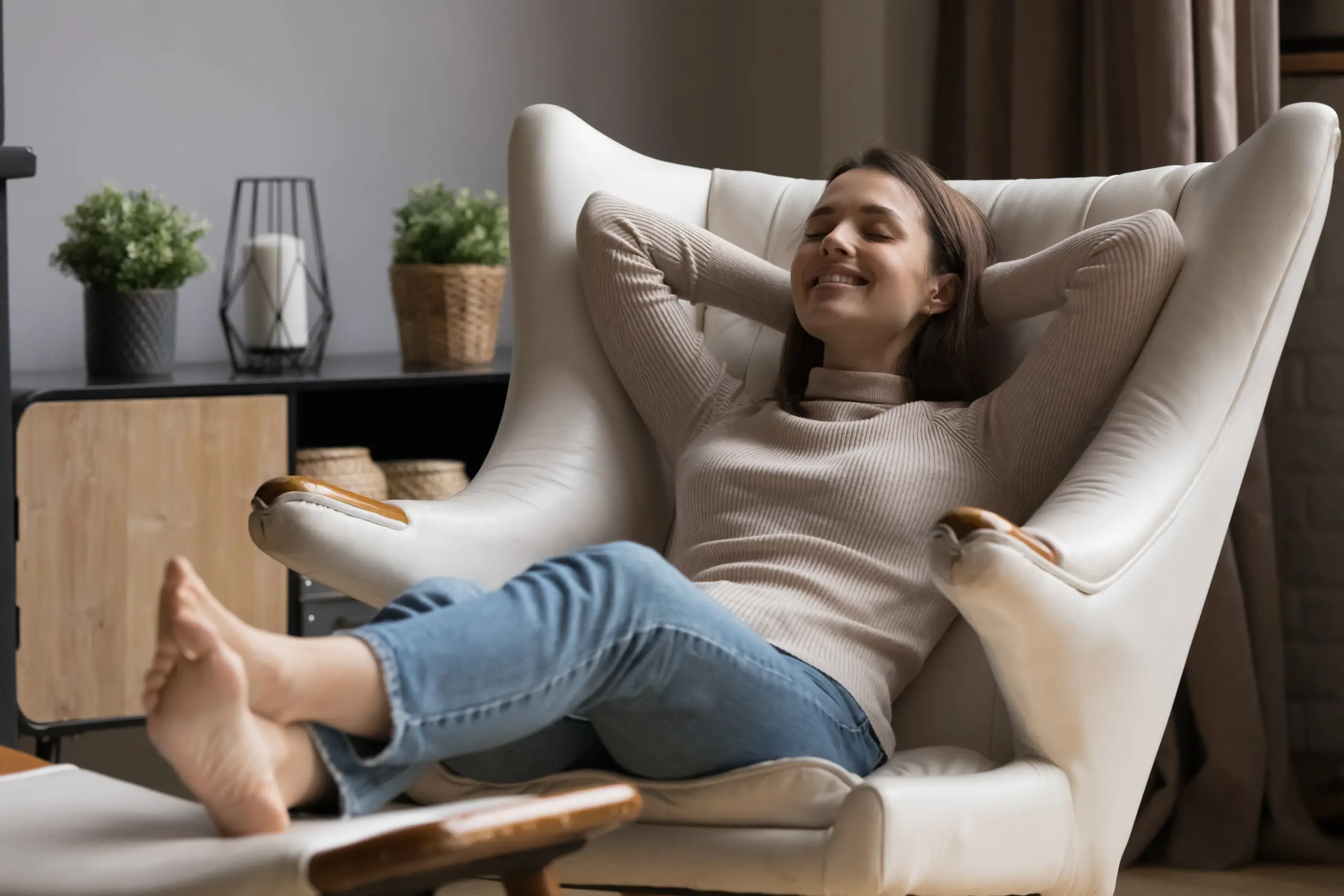 Woman Relaxing In Comfortable Chair